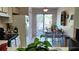 Bright kitchen featuring an adjacent dining area and a sliding door leading to outdoor space at 2922 Burlington Dr, Apopka, FL 32703