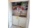 Practical laundry closet with a washer, dryer, and wire shelving for organized storage at 2922 Burlington Dr, Apopka, FL 32703