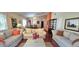 Spacious living room featuring comfortable couches, vaulted ceilings and lots of natural light at 2922 Burlington Dr, Apopka, FL 32703
