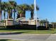 Elegant community sign for Preserve at Sunrise surrounded by manicured landscaping and palm trees at 312 Irving Bend Dr, Groveland, FL 34736