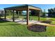 Picturesque wooden gazebo in a community area with picnic tables and scenic lake views at 312 Irving Bend Dr, Groveland, FL 34736