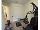 Home gym featuring a multi-station machine and various exercise equipment at 312 Irving Bend Dr, Groveland, FL 34736