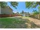 The backyard has a grass lawn and wooden fence at 314 E Harwood St, Orlando, FL 32801