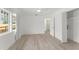 Bright bedroom featuring light wood floors and large windows at 314 E Harwood St, Orlando, FL 32801