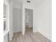 Bright bedroom featuring light wood floors and a closet at 314 E Harwood St, Orlando, FL 32801