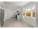 Bright kitchen features stainless steel appliances, light wood floors, and white cabinets at 314 E Harwood St, Orlando, FL 32801