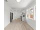 Well-lit kitchen boasts white cabinets, modern appliances, and convenient layout at 314 E Harwood St, Orlando, FL 32801