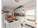 Functional kitchen with appliances and white cabinetry at 314 E Harwood St, Orlando, FL 32801