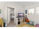 Comfortable living room with vinyl collection and a view into the main bedroom at 314 E Harwood St, Orlando, FL 32801