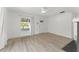 Bright living room with ample space featuring laminate flooring, natural light and white walls at 314 E Harwood St, Orlando, FL 32801