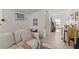 Bright living room featuring a comfortable couch and view into the bathroom at 314 E Harwood St, Orlando, FL 32801