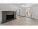 Spacious living room featuring decorative fireplace and seamlessly flowing into other spaces at 314 E Harwood St, Orlando, FL 32801