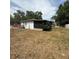 Fenced backyard with plenty of space and a view of the back side of the house at 337 Live Oak Blvd, Sanford, FL 32773