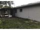 View of the back of the home with a screened in patio at 337 Live Oak Blvd, Sanford, FL 32773