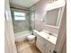 Bathroom featuring a vanity, toilet and shower with tiled walls at 337 Live Oak Blvd, Sanford, FL 32773