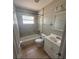 Updated bathroom featuring a shower and tub, large mirror and updated vanity at 337 Live Oak Blvd, Sanford, FL 32773