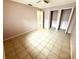 Bedroom with neutral colored walls and tiled flooring that features closet space at 337 Live Oak Blvd, Sanford, FL 32773