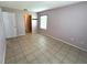 Bedroom featuring neutral colored walls, window and tiled flooring at 337 Live Oak Blvd, Sanford, FL 32773