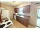 Well-lit kitchen featuring wood cabinets, a stainless steel sink, and essential appliances at 337 Live Oak Blvd, Sanford, FL 32773