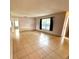 Bright living room with tile floors, a window, and a neutral color scheme at 337 Live Oak Blvd, Sanford, FL 32773
