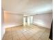 Spacious living room features tile flooring and access to an outdoor patio at 337 Live Oak Blvd, Sanford, FL 32773