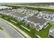 An aerial view showing the exteriors of a neighborhood's townhomes in a community with lush landscaping at 3600 Plainview Dr, Orlando, FL 32824