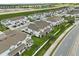 An aerial view showing the exteriors of a neighborhood's townhomes on a bright sunny day at 3600 Plainview Dr, Orlando, FL 32824