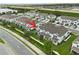 An aerial view displays the exteriors of a neighborhood's townhomes in a community with lush landscaping at 3600 Plainview Dr, Orlando, FL 32824