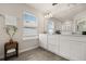 Bright bathroom boasts a dual sink vanity and an accent plant for added freshness at 3600 Plainview Dr, Orlando, FL 32824