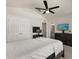 Bedroom with fan, double closets, bathroom access and a view to the outside at 3600 Plainview Dr, Orlando, FL 32824