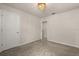 A carpeted bedroom has a closet and overhead lighting at 3600 Plainview Dr, Orlando, FL 32824