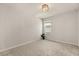 Bright, carpeted bedroom featuring a modern chandelier and a window at 3600 Plainview Dr, Orlando, FL 32824