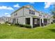 Exterior view of a well-maintained two-story home with a screened-in porch at 3600 Plainview Dr, Orlando, FL 32824
