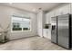 Bright kitchen featuring stainless steel refrigerator and large window that allows plenty of natural light at 3600 Plainview Dr, Orlando, FL 32824