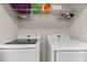 Bright laundry room with new Samsung washer and dryer and storage shelf at 3600 Plainview Dr, Orlando, FL 32824