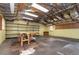 Unfinished basement with exposed ceiling, shelving, and workbench at 407 Ventura Dr, Sanford, FL 32773