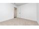 Bedroom features neutral carpet and white walls with access to the ensuite bathroom and a walk-in closet at 407 Ventura Dr, Sanford, FL 32773
