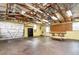Spacious garage featuring work area, pegboard, storage shelves, and roll-up doors for convenient access at 407 Ventura Dr, Sanford, FL 32773