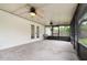 Screened in porch with ceiling fans and access to the backyard through french doors and the main house at 407 Ventura Dr, Sanford, FL 32773
