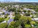 An aerial view showcases the neighborhood with tree-lined streets and lush green lawns at 424 E Muriel St, Orlando, FL 32806