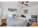 Bedroom with a bookshelf, soft lighting, and a sitting chair, creating a relaxing and inviting space at 424 E Muriel St, Orlando, FL 32806