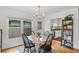 Cozy dining area adjacent to the kitchen with natural lighting and classic decor at 424 E Muriel St, Orlando, FL 32806