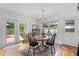 Bright dining area with sliding glass doors leading to a deck, offering an indoor-outdoor lifestyle at 424 E Muriel St, Orlando, FL 32806