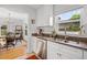 Well-lit kitchen with modern appliances and view to dining area at 424 E Muriel St, Orlando, FL 32806