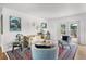 Inviting living room with stylish furniture, bright colors, and view to outdoor deck at 424 E Muriel St, Orlando, FL 32806
