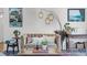 Cozy living room featuring a comfortable sofa, stylish decor, and a chic floor lamp at 424 E Muriel St, Orlando, FL 32806