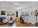 Bright home office featuring hardwood floors, natural light, and modern desk setup with multiple monitors at 424 E Muriel St, Orlando, FL 32806