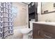Compact bathroom featuring a shower-tub combo, vanity with cabinet, and practical layout at 436 Azores Ave, Orlando, FL 32811