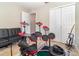Bedroom featuring a drumset, sofa, guitar, large closet space, and tile flooring at 436 Azores Ave, Orlando, FL 32811