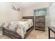 Cozy bedroom features neutral decor, a comfortable bed, and a matching dresser at 436 Azores Ave, Orlando, FL 32811